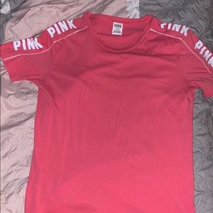 Pink brand shirt with logo on arms
